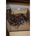 Box of craftsman made iron and leather pendants and hair pieces