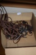 Box of craftsman made iron and leather pendants and hair pieces