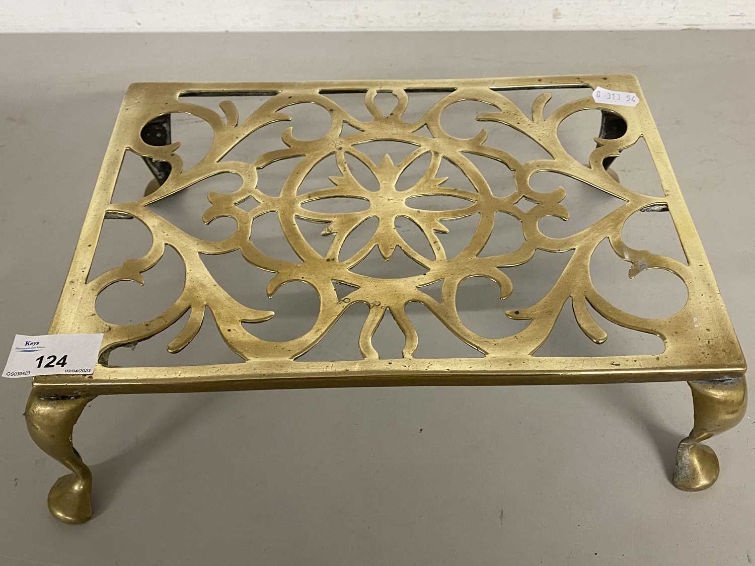 Brass four footed trivet