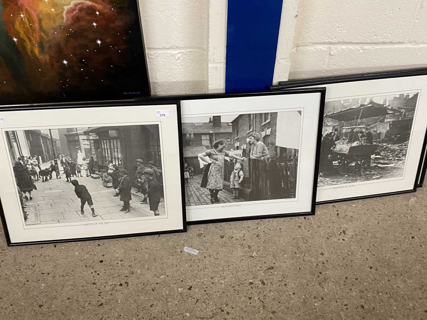 Group of four framed black and white photographs, early 20th Century city street scenes
