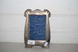 Silver mounted photograph frame bearing Birmingham hallmarks, 21cm high, lacking easel back