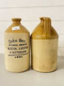 Two stone ware flagons, one marked Dakin Bros
