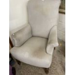 Grey upholstered armchair on turned legs