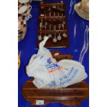 Display rack of crested spoons together with a display rack of modern thimbles