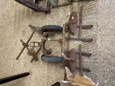 Selection of vintage iron cultivator or tractor attachments