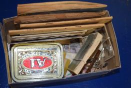 Box of various mixed items to include assorted cigarette and tea cards, vintage tobacco tin, tie