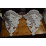 Pair of modern composition wall brackets decorated with gothic mask detail