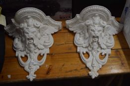 Pair of modern composition wall brackets decorated with gothic mask detail