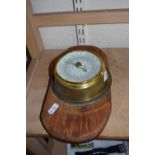 Brass cased barometer on wooden back