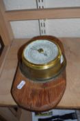 Brass cased barometer on wooden back