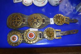 Two leather straps of horse brasses