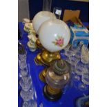 Two brass based oil lamps and one other (3)