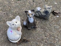 Three small concrete animals