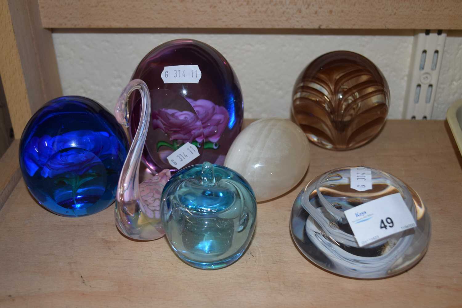 Mixed Lot: Various assorted paperweights, glass swan, polished stone egg etc