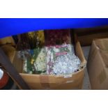 Box of various fake flowers and foliage