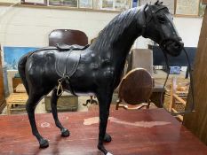 Leather mounted model of a horse
