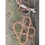 Iron stand constructed from horseshoes together with an iron fire tool stand and a abstract metal