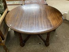 Circular oak coffee table on turned legs