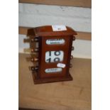 Small wooden cased perpetual desk calendar, 16cm high