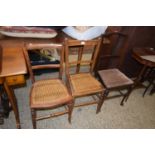 Two cane seated bedroom chairs and one other (3)