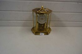 Kundo mantel clock in glazed brass mounted case