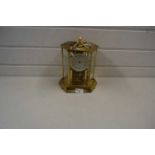 Kundo mantel clock in glazed brass mounted case