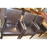 Set of four modern leather covered armchairs
