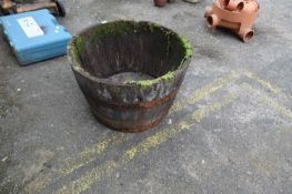 Iron bound wooden half barrel planter