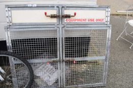 Pair of mesh doors marked 'Equipment Use Only'