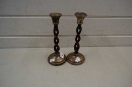 Pair of wood and silver mounted candlesticks of barley twist form