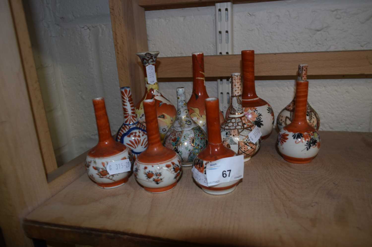 Eleven various small Japanese stem vases to include Imari and Satsuma examples