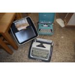 Two vintage portable typewriters