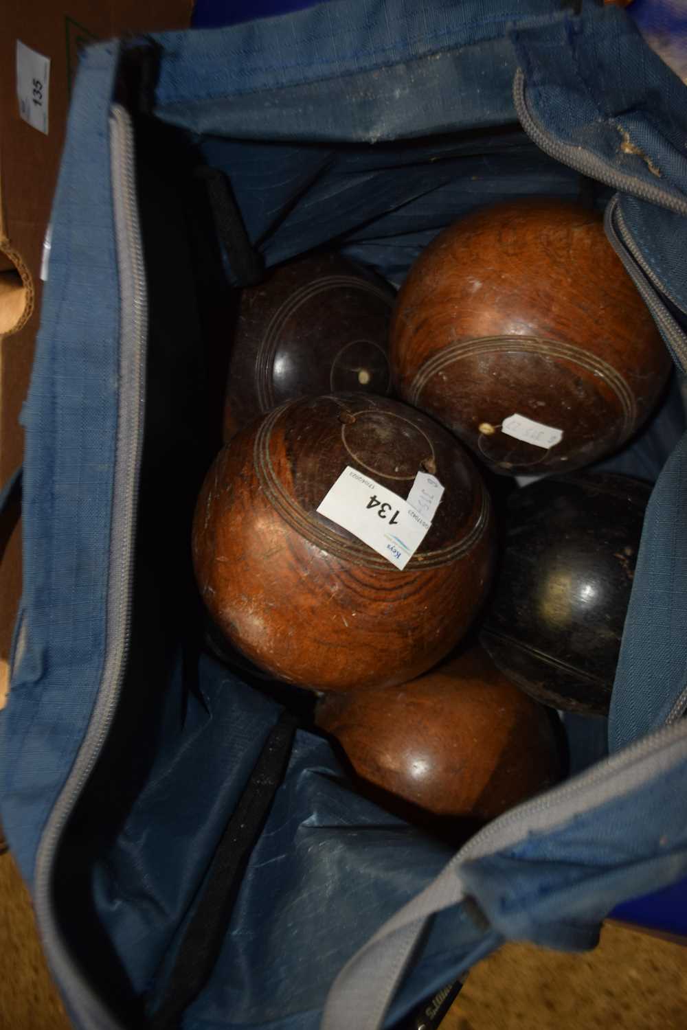 Case of vintage wooden lawn bowls