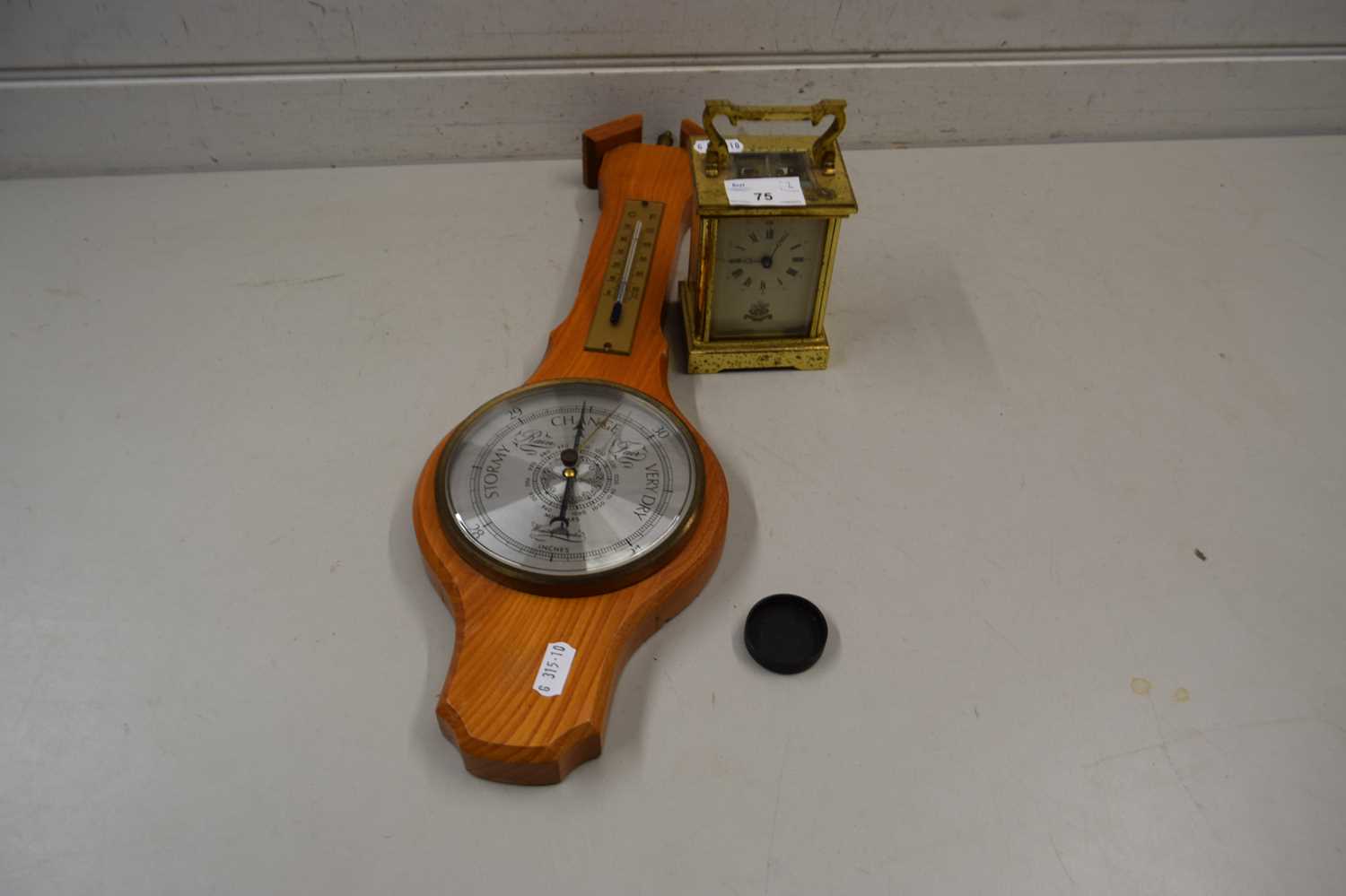 Brass cased carriage clock together with a small barometer