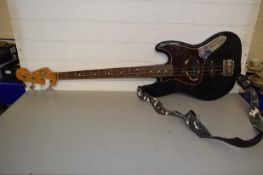 Fender jazz bass guitar with padded travel case, very worn condition
