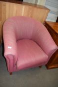 Pink upholstered tub chair