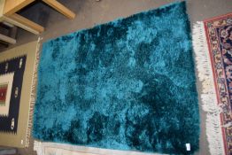 Modern small turquoise polyester rug