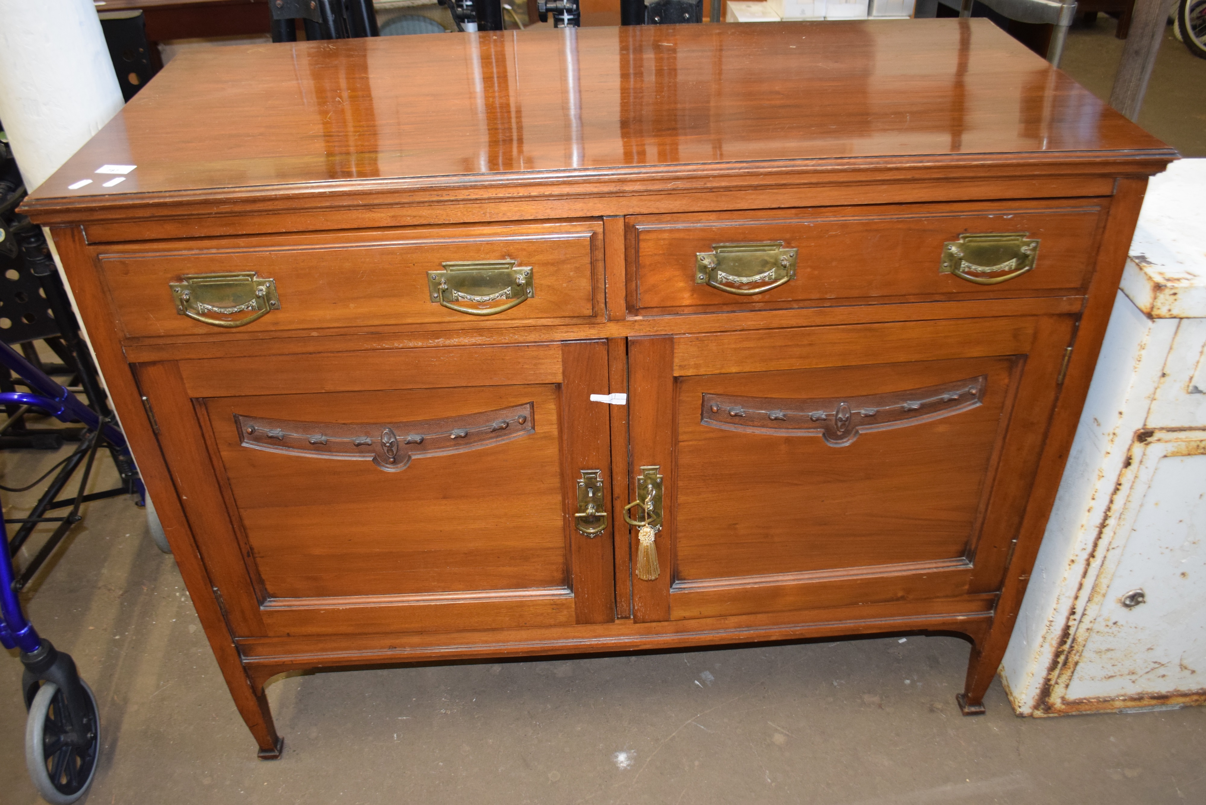 Late Victorian American walnut two door two drawer sideboard
