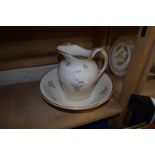 Minton wash bowl and jug decorated with pink flowers and gilt decoration