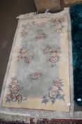 Small Chinese floral decorated rug