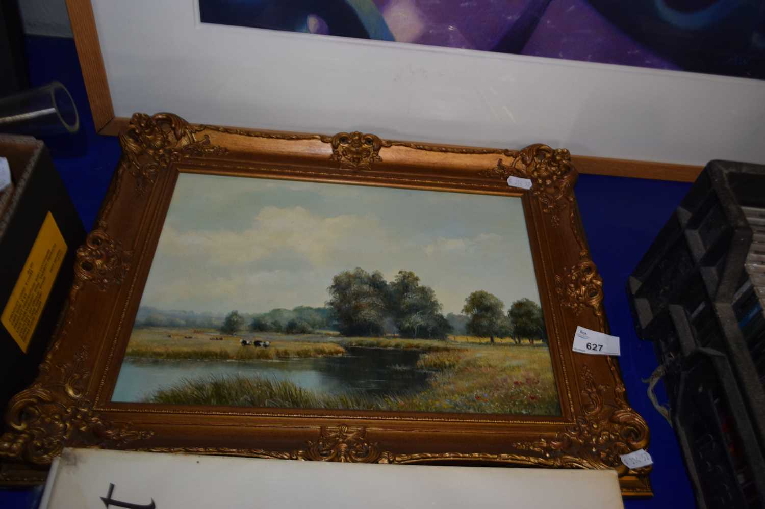 Cows grazing by a river, oil on canvas in modern gilt frame