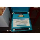 Petit Super International turquoise cased typewriter