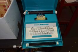 Petit Super International turquoise cased typewriter