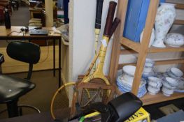 Tennis racket and two badminton rackets