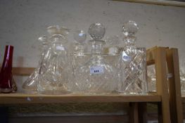 Six glass decanters and stoppers
