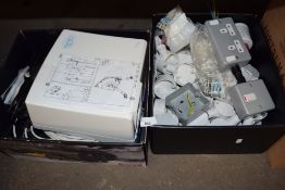 Two boxes of various electrical spares to include a hand dryer, various switches and other items