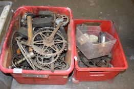 Two boxes of various bicycle parts