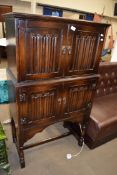 20th Century oak drinks cabinet with linen fold carved detail