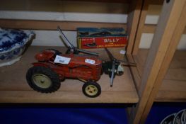 Model Massey Harris tractor together with a toy helicopter and Billy the Ball Blowing Magic Whale