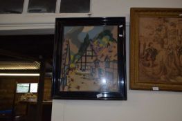 Needlework picture of cottages, framed and glazed